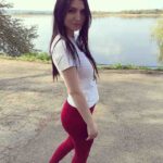 Independent Russian Escort in Delhi Senia standing by the lake