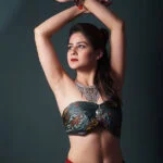 Priya in a sexy ethinc dress posing