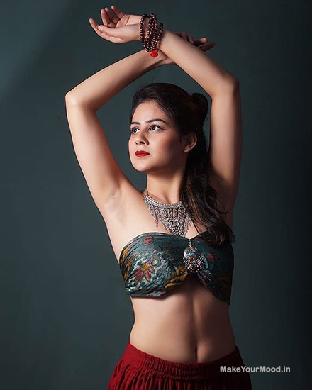 Priya in a sexy ethinc dress posing